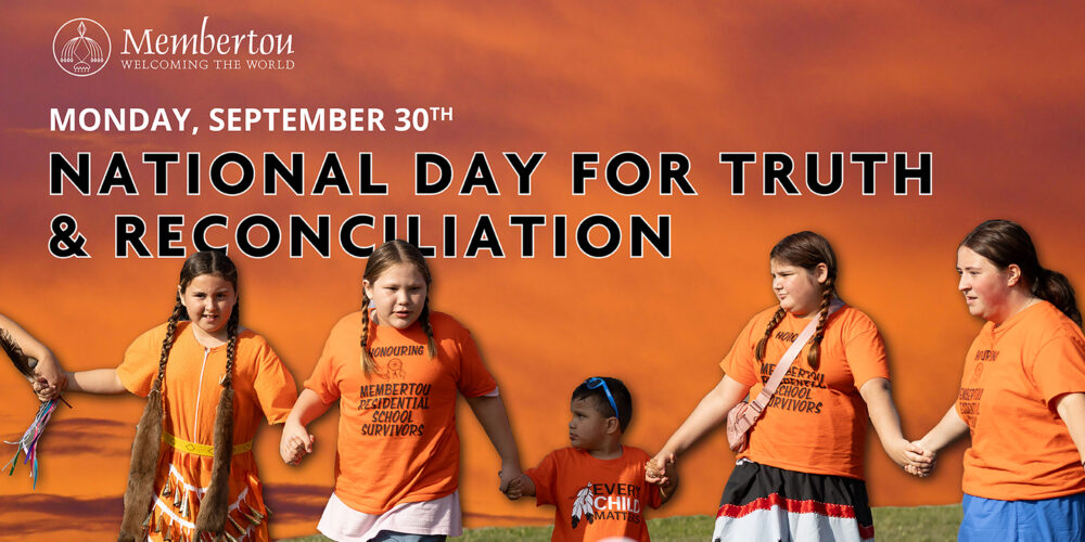 A photo of indigenous youth wearing orange shirts honouring National Day for Truth & Reconciliation within Membertou.