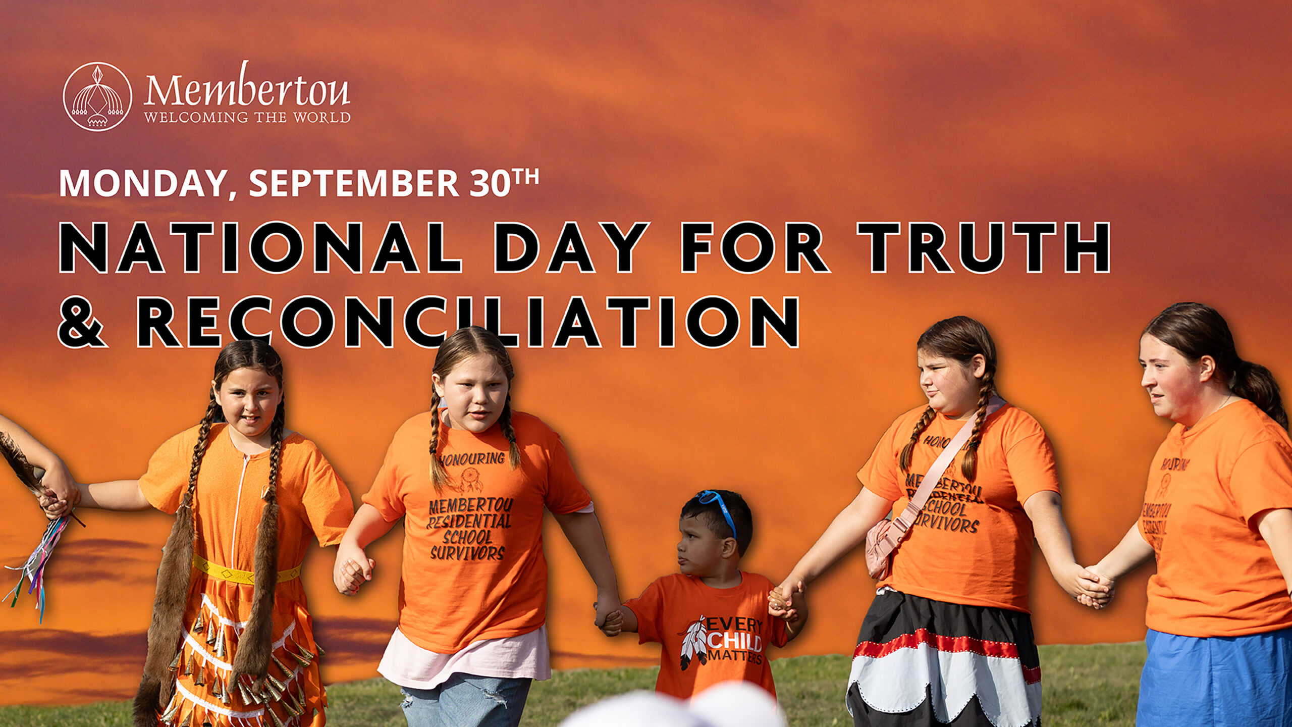 A photo of indigenous youth wearing orange shirts honouring National Day for Truth & Reconciliation within Membertou.